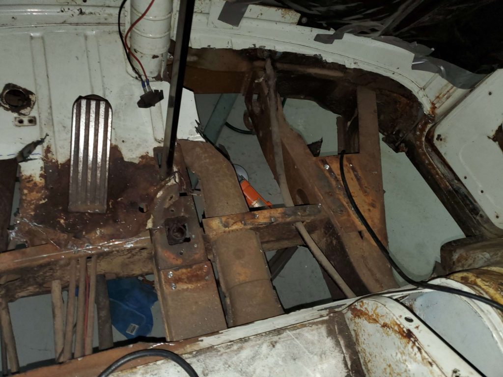 Late Model Volkswagen bus passenger's side front floor removed.